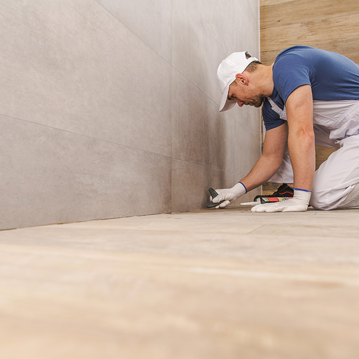 man working on a flooring repair north fort myers fl
